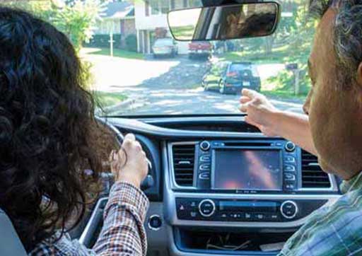 Teen and parent in car