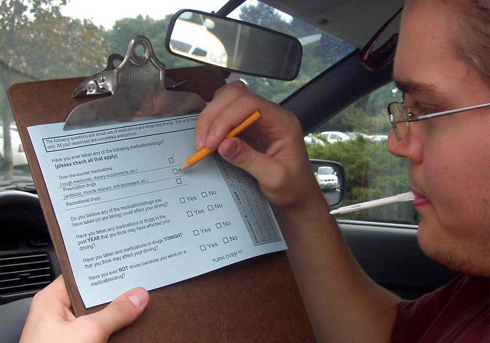 Driver filling out survey form